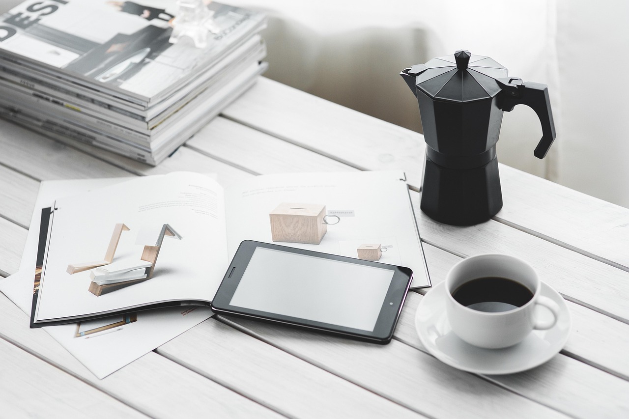 Technology, tablet, coffee cup — Affiliate FAQs for 82 Lottery Partners