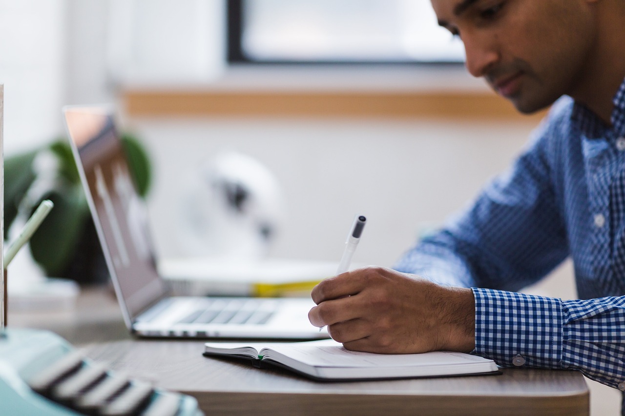 Man, writing, laptop — How you can Optimize Performance within an Exam? - 15 Rules for achievement in Academic Examinations