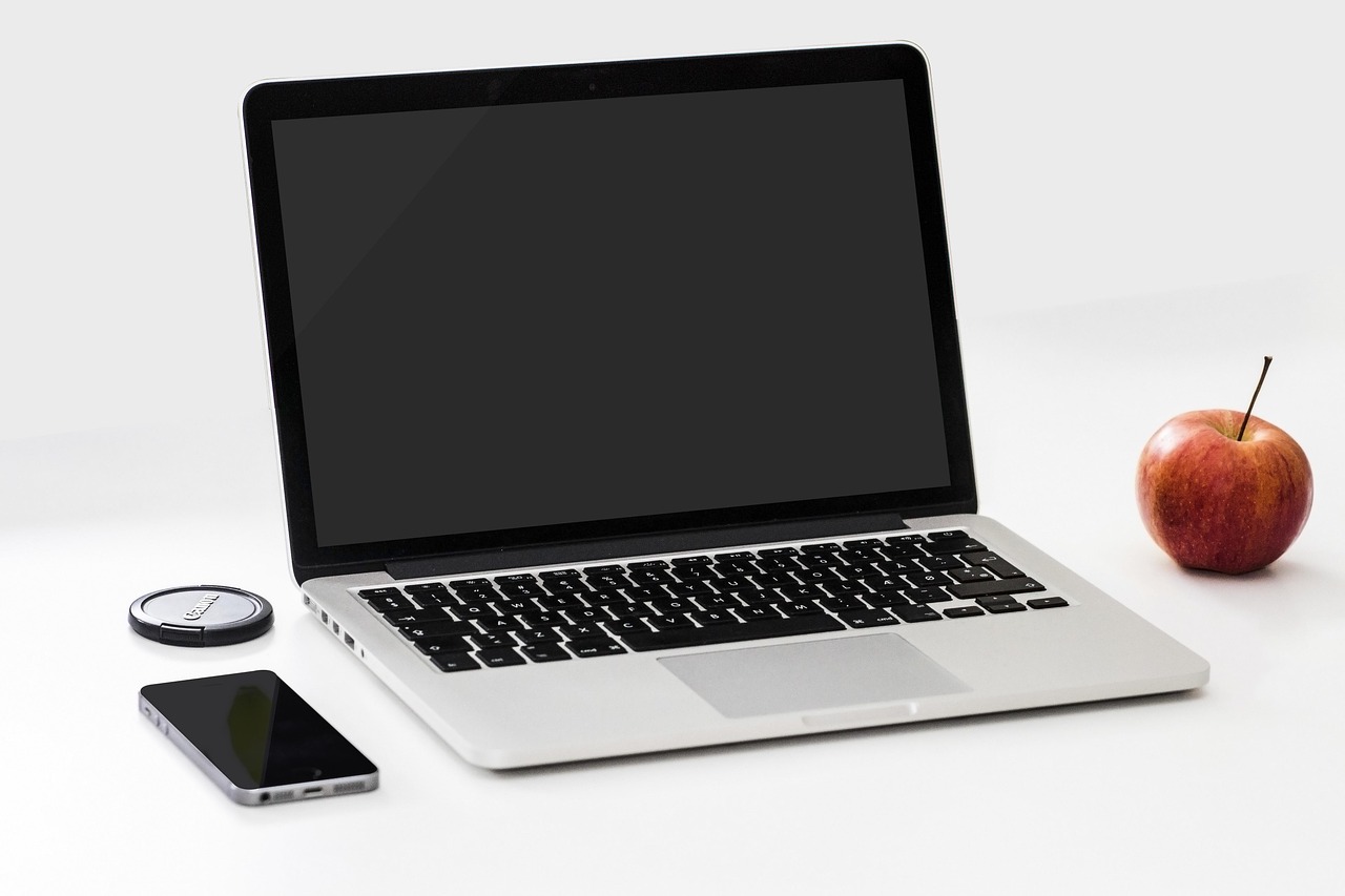 Apple, smartphone, desk — Where a CIO Should Focus: Navigating the Modern Tech Landscape